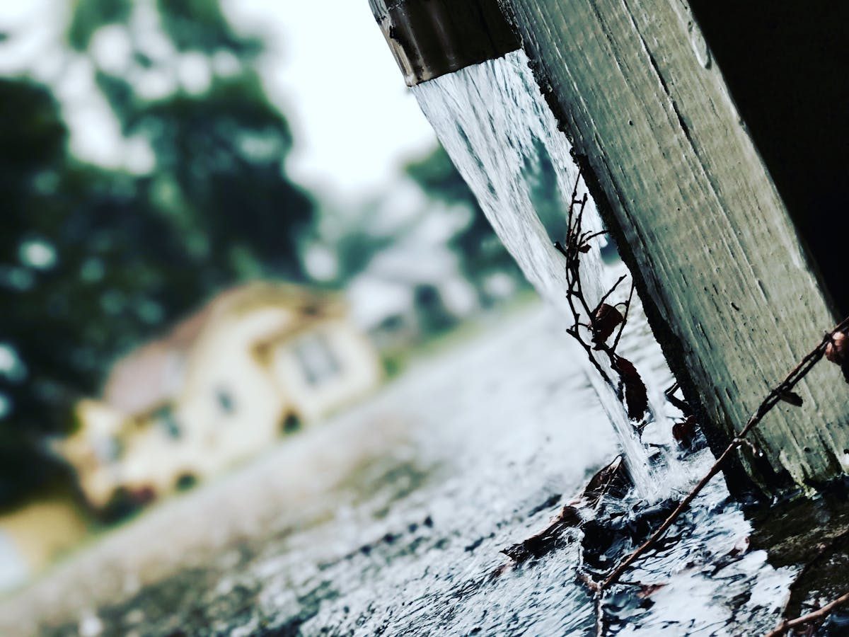 Seamless aluminum rain gutters along the edge of a roof
